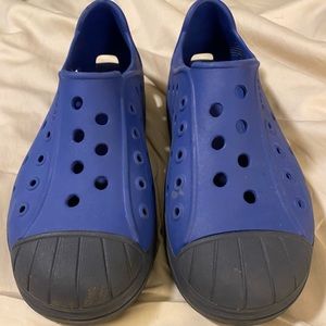 Big kids size 3 Crocs. Light blue and navy blue.